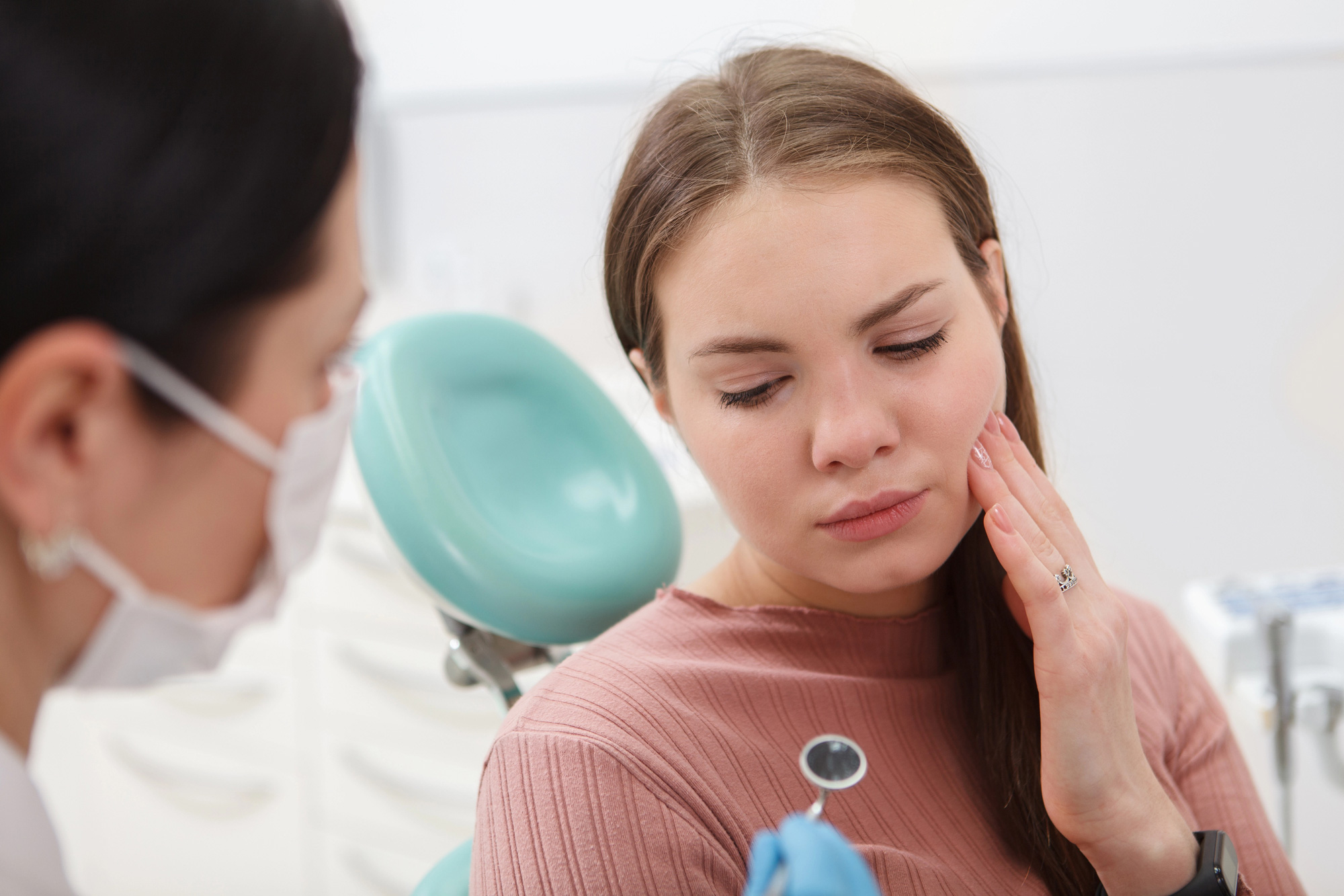 Close up of a woman with toothache having dental appointment