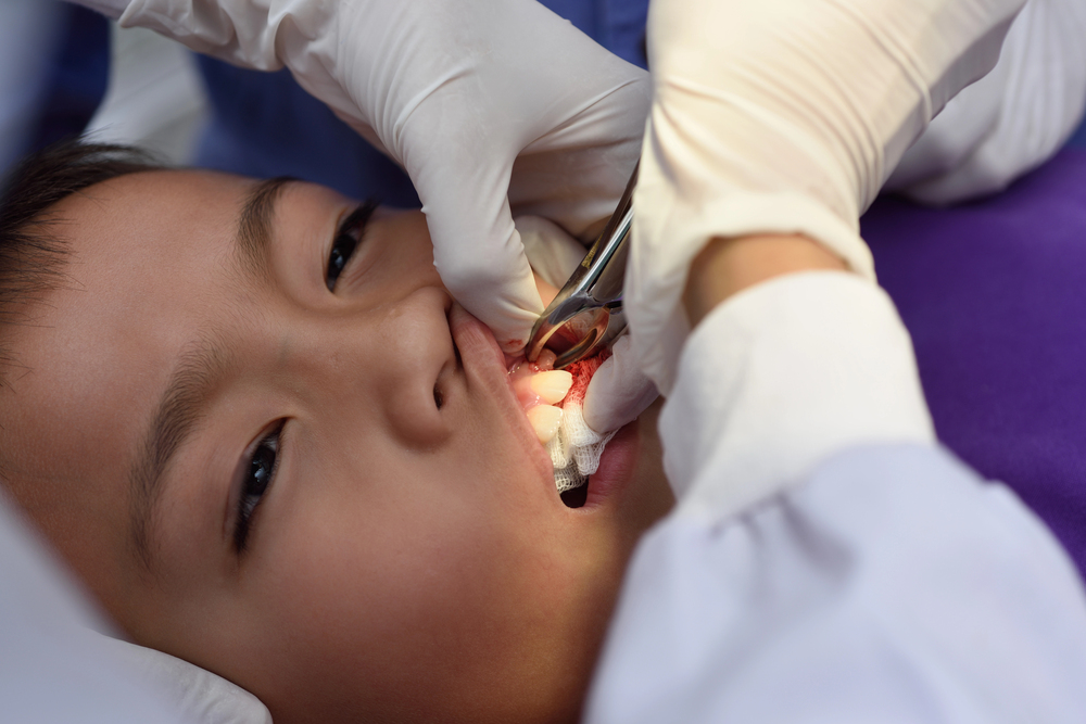 Boy on tooth extraction