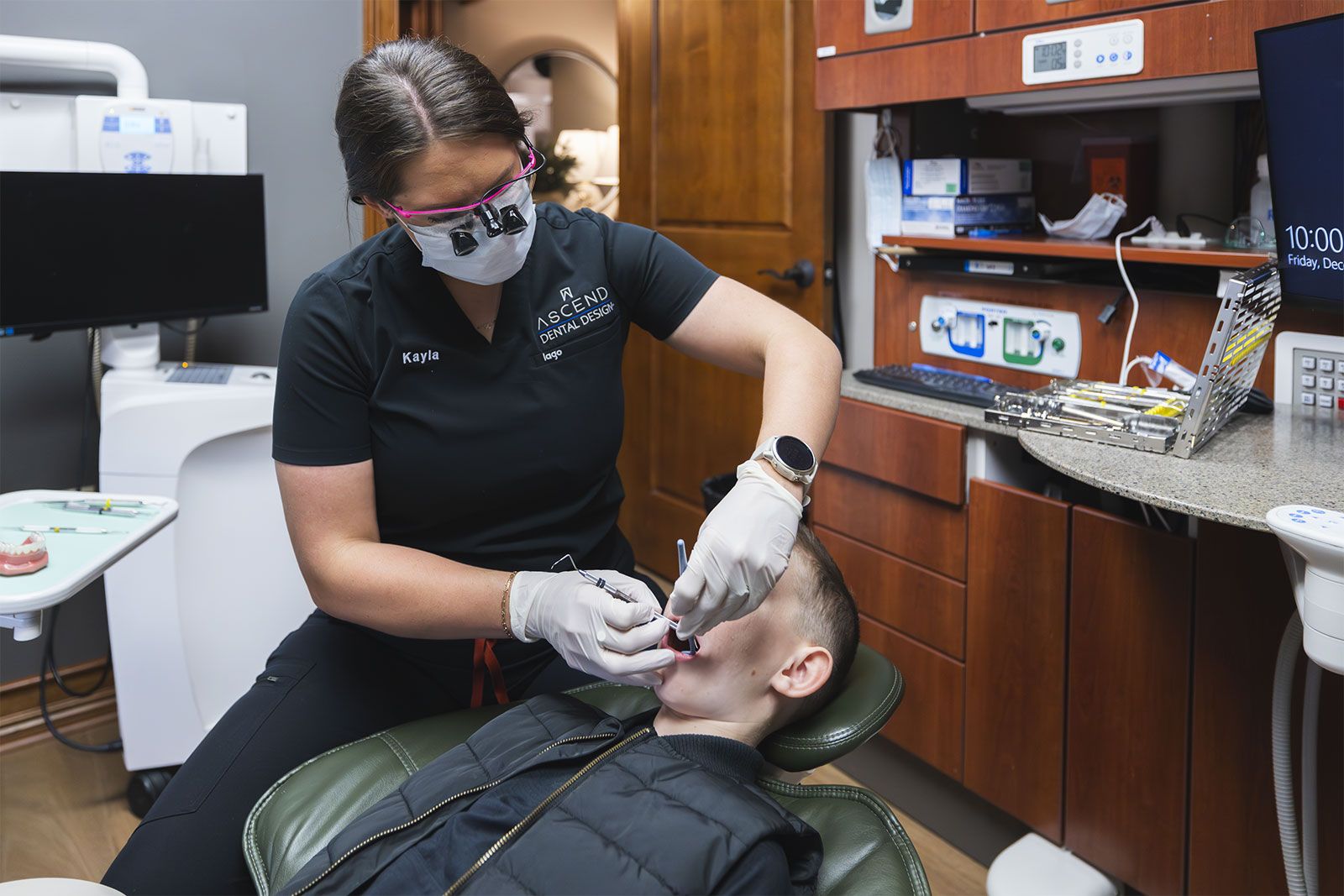 Dental hygienist performing a cleaning on a child